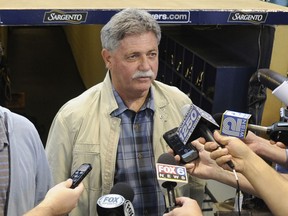 FILE - In this Sept. 27, 2014, file photo, then-Milwaukee Brewers general manager Doug Melvin speaks to the media before a baseball game against the Chicago Cubs in Milwaukee. Melvin is one of three finalists in contention to become general manager of the New York Mets.