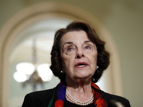 FILE - In this Oct. 4, 2018, file photo Sen. Dianne Feinstein, D-Calif., speaks to the media on Capitol Hill, in Washington. A Southern California man has been arrested after authorities say he sent an email threatening to kill Feinstein, on Sept. 30.