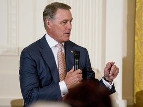 FILE - In an Aug. 20, 2018 file photo, Sen. David Perdue, R-Ga., speaks at a roundtable during an event to salute U.S. Immigration and Customs Enforcement (ICE) officers and U.S. Customs and Border Protection (CBP) agents at the White House in Washington. A Georgia Tech student is suing U.S. Sen. David Perdue, accusing the politician of snatching a cellphone from him during a campaign event in Atlanta.