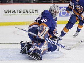 New York Islanders goaltender Robin Lehner deflects a shot during the first period of an NHL hockey game against the San Jose Sharks, Monday, Oct. 8, 2018, in New York.