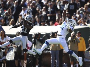 Indianapolis Colts tight end Mo Alie-Cox (81) catches a pass for a touchdown against Oakland Raiders cornerback Gareon Conley (21) during the first half of an NFL football game in Oakland, Calif., Sunday, Oct. 28, 2018.
