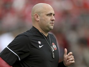 FILE - In this Sept. 16, 2017 photo, Ohio State assistant coach Zach Smith watches before the start of an NCAA college football game against Army in Columbus, Ohio. Fired Ohio State assistant football coach Zach Smith has pleaded guilty Tuesday, Oct. 23, 2018, to a reduced charge of disorderly conduct and an Ohio court issued a three-year protective order that keeps him away from his ex-wife.