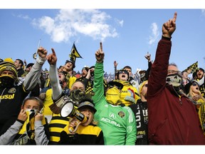 Fans yell a player's name as it's announced before the start of an MLS soccer game between Columbus Crew SC and Minnesota United at the Mapfre Stadium on Sunday, Oct. 28, 2018.
