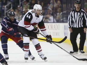 Arizona Coyotes' Kevin Connauton, right, carries the puck up ice as Columbus Blue Jackets' Anthony Duclair defends during the first period of an NHL hockey game Tuesday, Oct. 23, 2018, in Columbus, Ohio.