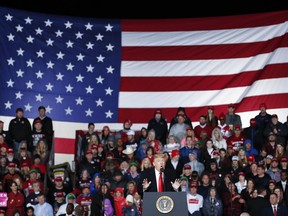 President Donald Trump speaks at a rally endorsing the Republican ticket, Friday, Oct. 12, 2018, in Lebanon, Ohio.