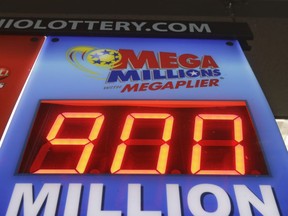 The Mega Millions jackpot is displayed at the Corner Market, Wednesday, Oct. 17, 2018, in Lyndhurst, Ohio. The lottery jackpot is now up to $900 million. The next drawing will be Friday. The estimated jackpot for that drawing would be the second-largest lottery prize in U.S. history.