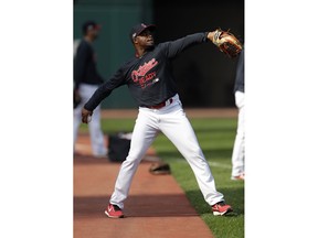 Cleveland Indians' Rajai Davis throws during a baseball workout, Wednesday, Oct. 3, 2018, in Cleveland. The Indians play the Houston Astros in Game 1 of the American League division series on Friday in Houston.