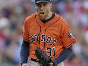 Houston Astros relief pitcher Collin McHugh pumps his fist after striking out Cleveland Indians' Yan Gomes in the seventh inning during Game 3 of a baseball American League Division Series, Monday, Oct. 8, 2018, in Cleveland.