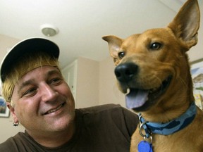 Quentin, with Randy Grim in August 2003, just after he survived the gas chamber at the St. Louis Animal Control pound.