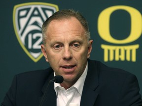 FILE - In this Nov. 29, 2016, file photo, Oregon athletic director Rob Mullens talks to the media in Eugene, Ore., after the firing NCAA college football head coach Mark Helfrich. There are a lot of new voices taking part in the College Football Playoffs selection process. Nearly half of the 13 committee members are serving for the first time. There are six new members taking part in the process to determine the first ranking for this season. It is the biggest turnover since the original group in 2013. The first 2018 ranking comes out Tuesday night, Oct. 30, 2018.  "Every committee, every group, and every year in unique too, so even if you have the same members, it would be unique because it's a different data set and a different year," said Mullens, the fourth-year committee member and new chairman.