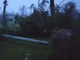 In this photo provided by Glen Hunter, damage from Super Typhoon Yutu is shown outside Hunter's home in Saipan, Commonwealth of the Northern Mariana Islands, Thursday Oct. 25, 2018.