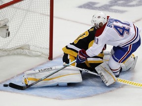 Montreal Canadiens' Paul Byron (41) scores against Pittsburgh Penguins goaltender Matt Murray (30) in the first period of an NHL hockey game in Pittsburgh, Saturday, Oct. 6, 2018.