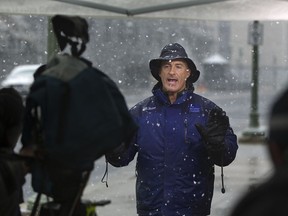 FILE - In this Oct. 29, 2011, file photo, The Weather Channel host, Jim Cantore goes live from Commonwealth Avenue behind the Pennsylvania State Capitol in Harrisburg, Pa. A Florida county threatened by Hurricane Michael is warning a television meteorologist to stay away. The Santa Rosa County Sheriff's Office posted a tongue-in-cheek trespass warning on Facebook for Cantore. Cantore is usually on the scene of major storms.