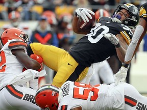 Pittsburgh Steelers running back James Conner (30) gets over Cleveland Browns outside linebacker Christian Kirksey (58) for a first down in the first quarter of an NFL football game, Sunday, Oct. 28, 2018, in Pittsburgh.