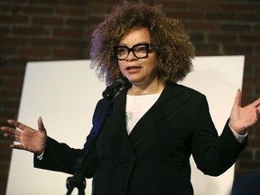 FILE - In this March, 20, 2018, file photo, renowned costume designer Ruth Carter, who has designed for films including "Roots" and "Black Panther," introduces a new retrospective fashion exhibition, Heros & Sheros: A Ruth E. Carter Costume Exhibition at the Heinz History Center in Pittsburgh. Carter, the creator of numerous Hollywood films, will receive the career achievement award at next year's Costume Designers Guild Awards. The guild announced Tuesday, Oct. 23, that the two-time Academy Award nominee will receive the honor at the 21st annual ceremony held on February 19 in Beverly Hills, California.