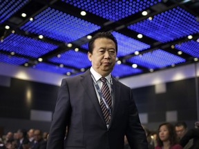 FILE - In this July 4, 2017 file photo, Interpol President, Meng Hongwei, walks toward the stage to deliver his opening address at the Interpol World congress in Singapore. A French judicial official says Friday Oct.5, 2018 the president of Interpol has been reported missing after traveling to China.
