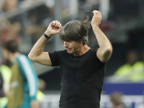 Germany's head coach Joachim Loew reacts as he watches his players during a UEFA Nations League soccer match between France and Germany at Stade de France stadium in Saint Denis, north of Paris, Tuesday, Oct. 16, 2018.