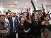 Supporters of Brampton mayoral candidate Patrick Brown react as early results are shown on a screen, at his campaign event in Brampton.