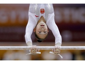 China's Liu Tingting performs on the uneven bars during the women's team final of the Gymnastics World Chamionships at the Aspire Dome in Doha, Qatar, Tuesday, Oct. 30, 2018.