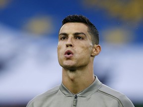 FILE - In this Oct. 6, 2018, file photo, Juventus forward Cristiano Ronaldo warms up prior to a soccer match against Udinese, in Udine, Italy. Ronaldo's new Las Vegas lawyer is calling documents cited in media reports about a woman's claim that he raped her in 2009 "complete fabrications," and says the encounter was consensual.