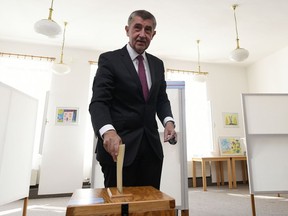 FILE-In this Friday Oct. 5, 2018, file photo, Czech Prime Minister Andrej Babis votes during the first day of local and first round of the elections for Parliament's upper house, the Senate, in Pruhonice near Prague, Czech Republic. Babis' party is facing a strong challenge from the opposition in the second round of the elections for Parliament's upper house.