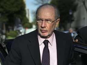 FILE - In this April 17, 2015 file photo, former Spanish Finance Minister and International Monetary Fund chief Rodrigo Rato arrives at his apartment in Madrid, Spain. Spain's Supreme Court has confirmed on Wednesday Oct. 3, 2018, a 4 ½-year prison sentence for Rato for misusing a Spanish bank's corporate credit card. A judge will now need to set a date for the imprisonment.