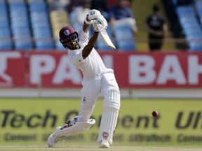 West Indies' cricketer Roston Chase bats during the third day of the first cricket test match between India and West Indies in Rajkot, India, Saturday, Oct. 6, 2018.