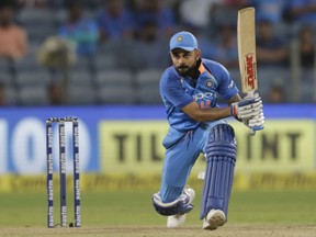 India's captain Virat Kohli bats during the third one-day international cricket match between India and West Indies in Pune, India, Saturday, Oct. 27, 2018.