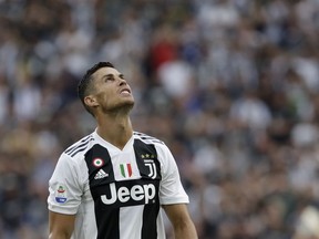 In this Aug. 25, 2018 file photo Juventus' Cristiano Ronaldo looks to the sky as he reacts during the Serie A soccer match between Juventus and Lazio at the Allianz Stadium in Turin, Italy.