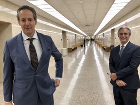 Jason Frank, right, and his attorney Eric George leave a Los Angeles County Superior Court on Monday, Oct. 22, 2108. On Monday a California judge has ordered Stormy Daniels' lawyer Michael Avenatti to pay $4.85 million to Frank, an attorney at his former law firm. The judge said Avenatti must pay the money because he personally guaranteed a settlement with Frank in a lawsuit over back pay.