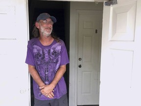Timothy Thomas talks about staying at home in Panama City Beach, Florida, for Hurricane Michael on Tuesday, Oct. 9, 2018. Thomas figures he and his wife will be safe from rising ocean water since they live in a second-story apartment. Others also aren't leaving, and a bar along the beachfront road threw a hurricane party less than 2 miles away from Thomas' home as Michael pushed toward shore Tuesday night.