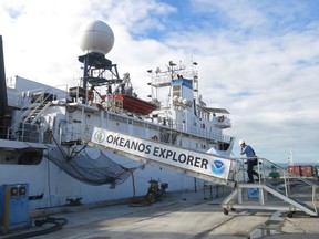 A member of a scientific team boards the Okeanos Explorer ship of the U.S. National Oceanic and Atmospheric Administration, in San Juan, Puerto Rico, Monday, Oct. 29, 2018. Scientists will analyze coral and fish habitats as well as map geological features, exploring new sites in deep waters around Puerto Rico and the U.S. Virgin Islands as part of the 22-day mission.