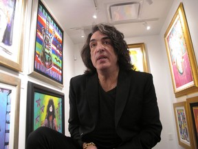 In this Oct. 13, 2018 photo, Paul Stanley, singer and guitarist for the rock group Kiss, speaks during an interview among his artwork at a gallery in Atlantic City, N.J. Stanley said he is open to the idea of former Kiss members performing as part of the band's upcoming farewell tour next year.