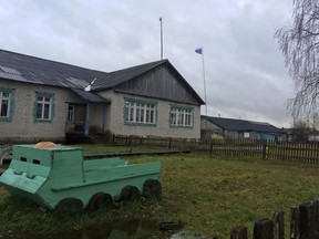 A toy tank stands at a playground near the local administration building in the village of Loyga, northern Russia, Wednesday Oct. 10, 2018. The career trajectories of suspected Russian military intelligence agents suggest how important the military are for ambitious young men determined to escape the gloom and poverty of rural Russia, like Loyga where suspected GRU agent Alexander Mishkin grew up.