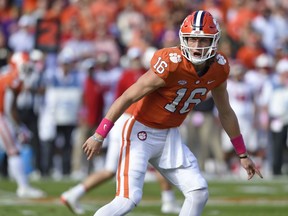 Clemson quarterback Trevor Lawrence calls a play during the first half of an NCAA college football game against North Carolina State, Saturday, Oct. 20, 2018, in Clemson, S.C.