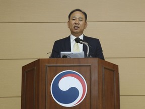 In this Oct. 17, 2018, photo, South Korea's Jeju Immigration Service director general Kim Do-kyoon comments on the status of the Yemeni asylum seekers at the Jeju Immigration Service in Jeju, South Korea. South Korean progressives are criticizing Seoul's government for rejecting refugee status to nearly 400 asylum seekers from war-ravaged Yemen whose arrival in the southern resort island of Jeju earlier this year triggered an anti-immigration uproar.