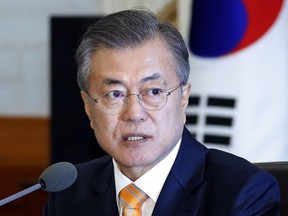 South Korean President Moon Jae-in speaks during a cabinet meeting at the presidential Blue House in Seoul, South Korea, Tuesday, Oct. 23, 2018. The government of Moon formally approved the rapprochement deals he made with North Korean leader Kim Jong Un last month.