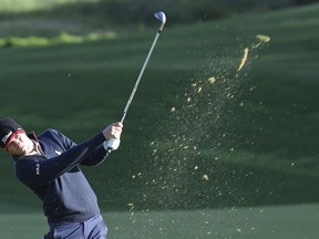 Justin Thomas of the United States blasts a shot on the 10th hole during the first round of the CJ Cup PGA golf tournament at Nine Bridges on Jeju Island, South Korea, Thursday, Oct. 18, 2018.