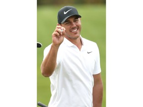 Brooks Koepka of the United States reacts after his shot on the 16th hole during the final round of the CJ Cup PGA golf tournament at Nine Bridges on Jeju Island, South Korea, Sunday, Oct. 21, 2018.