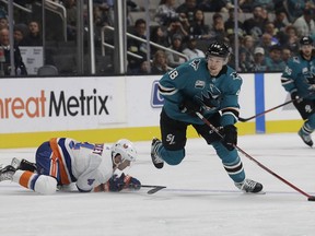 San Jose Sharks center Tomas Hertl (48), from the Czech Republic, skates past New York Islanders defenseman Thomas Hickey (4) during the first period of an NHL hockey game in San Jose, Calif., Saturday, Oct. 20, 2018.