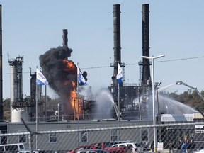 Flame and smoke erupts from the Irving Oil refinery in Saint John, N.B., on Monday, October 8, 2018.