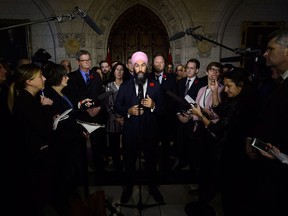 NDP Leader Jagmeet Singh speaks to reporters in the foyer of the House of Commons on Parliament Hill in Ottawa on Monday, Oct. 29, 2018.