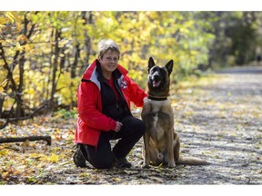 Kim Cooper of the Ottawa Valley Search and Rescue Dog Association is seen with her dog Grief in Stittsville, Ont., on Tuesday, Oct. 30, 2018.
