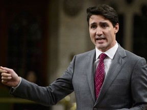 Prime Minister Justin Trudeau stands during question period in the House of Commons on Parliament Hill in Ottawa on Wednesday, Oct. 24, 2018.