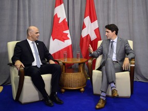 Prime Minister Justin Trudeau meets with the President of Switzerland Alain Berset during the Francophonie Summit in Yerevan, Armenia on Thursday, Oct. 11, 2018.