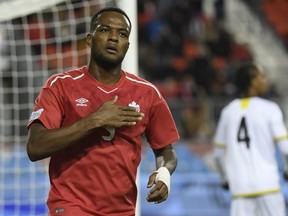 Canada's Cyle Larin celebrates scoring against Dominica during second half Concacaf Nations League qualifier soccer action in Toronto on Tuesday, October 16, 2018.