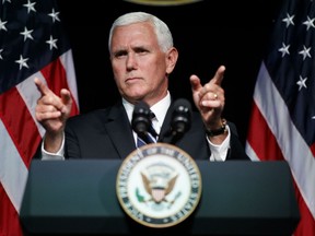 In this Aug. 9, 2018 file photo, Vice President Mike Pence gestures during an event on the creation of a U. S. Space Force at the Pentagon.  With his demand that the Pentagon create a new military service -- a Space Force to assure “American dominance in space” -- President Donald Trump has injected urgency into a long-meandering debate over the best way to protect U.S. interests in space, both military and commercial.