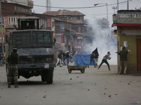 Kashmiri Muslim protesters clash with Indian government forces during the fourth phase of local elections in Srinagar, Indian controlled Kashmir, Tuesday, Oct. 16, 2018. India says the polls are a vital grass roots exercise to boost development and address civic issues. Political separatist leaders and armed rebel groups who challenge India's sovereignty over Kashmir have called for a boycott, saying the polls are an illegitimate exercise under military occupation. Authorities have deployed more than 40,000 additional soldiers in what is already one of world's most heavily militarised regions to guard the voting for urban and village councils.