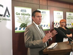 Manitoba Justice Minister Cliff Cullen speaks during a press conference in Winnipeg on Monday, Oct. 15, 2018. The Manitoba government says it is considering expanding its ban on smoking cannabis in public places to also exclude consumption of edible products. Justice Minister Cliff Cullen says the government is currently considering the change and a decision could come soon.