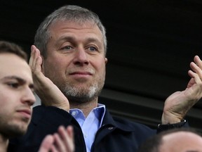 In this Saturday, March 22, 2014 file photo, Roman Abramovich applauds his Chelsea players after they defeated Arsenal 6-0 in the English Premier League.